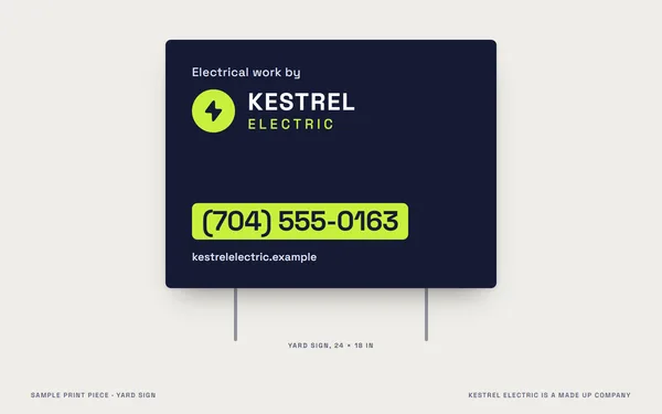 A yard sign for Kestrel Electric, a made up company, front and back